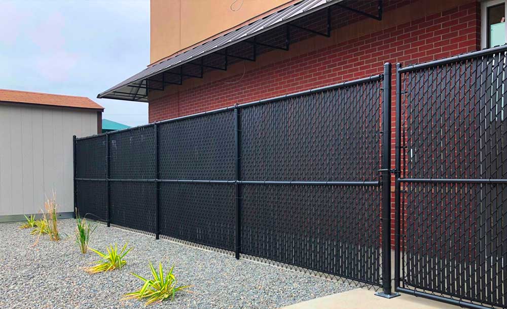 Black chain link with black privacy slats and mid rail