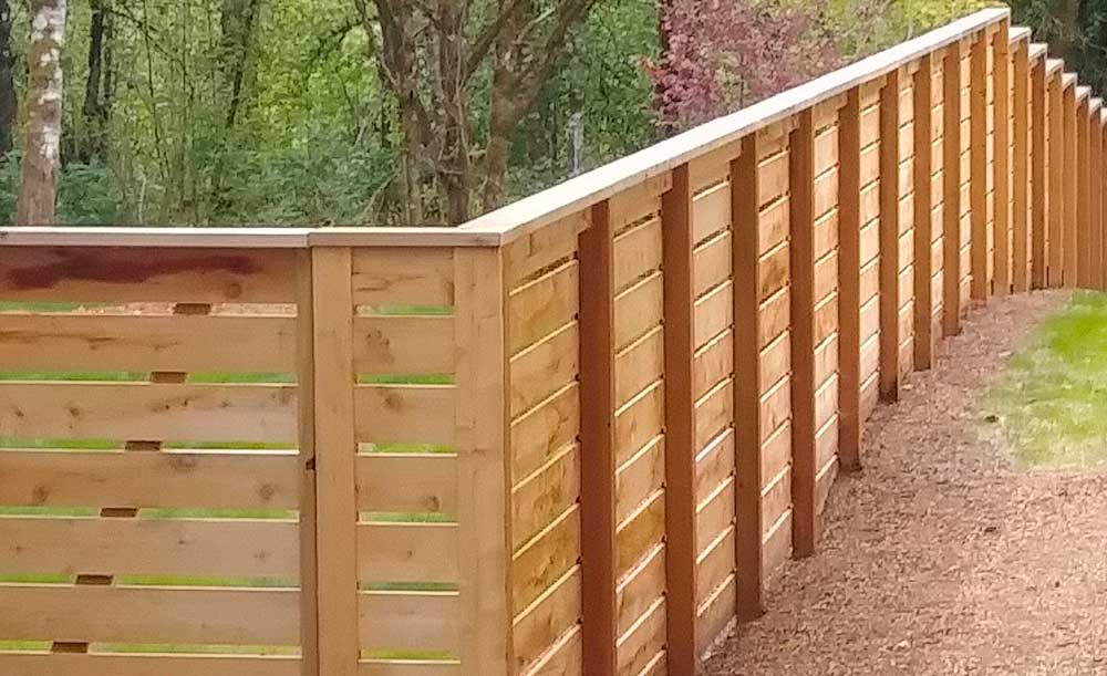 Horizonal style cedar fence with space