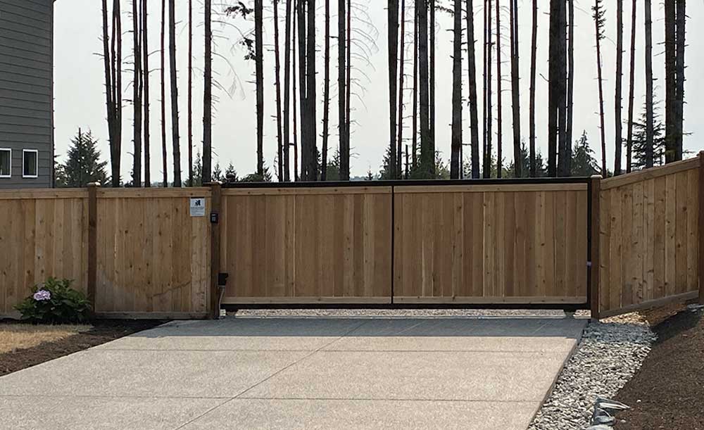 outside view of Steel frame cedar gate with DoorKing operator