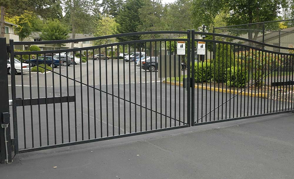 Custom ornamental double drive gate with automation
