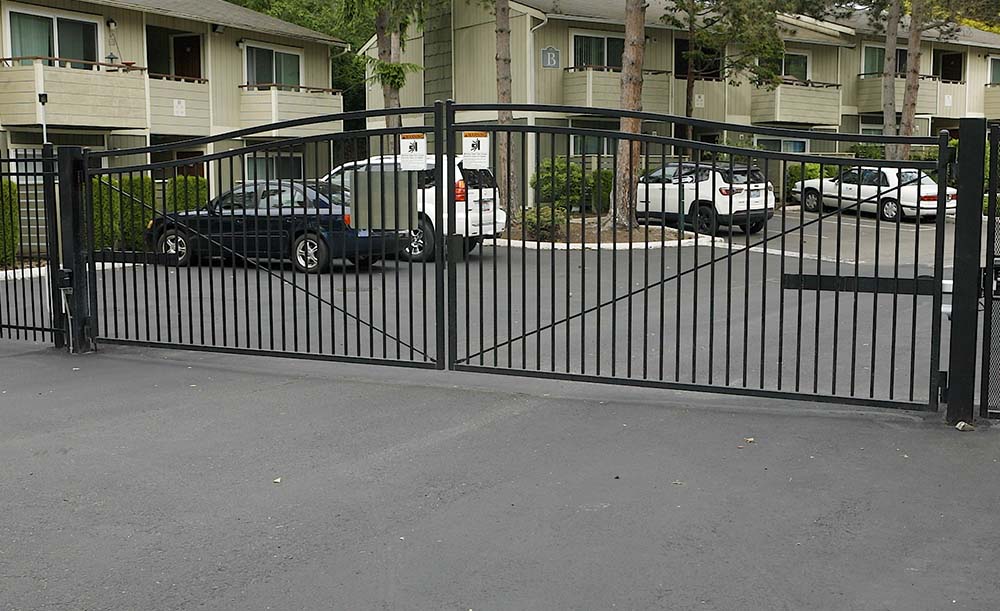 Custom ornamental double drive gate with automation