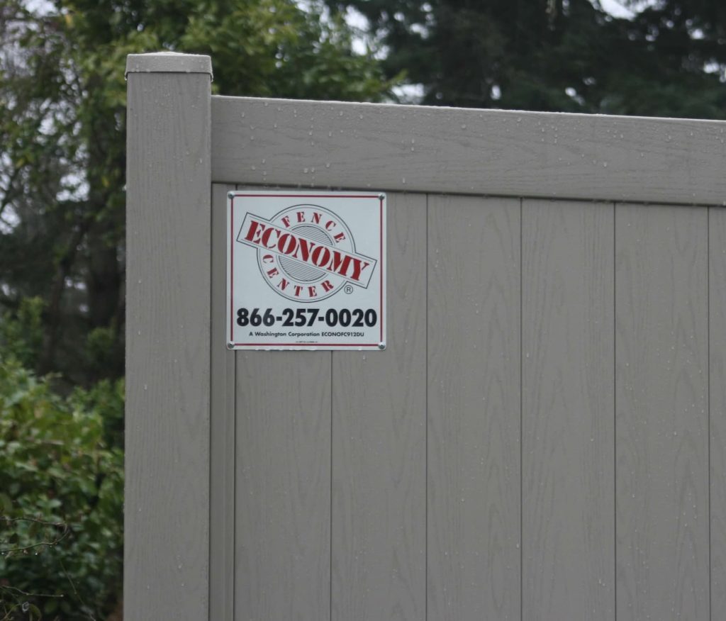Duramax Adobe 1 copy vinyl fence with economy fence center sign
